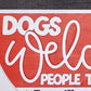 Text 'DOGS Welcome PEOPLE Tolerated' on a red and gray background with paw prints.
