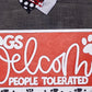 Dog bandana with text 'Dogs Welcome, People Tolerated' on a red background