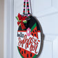 Decorative door hanger shaped like a watermelon with 'hello summer' text on a white door.