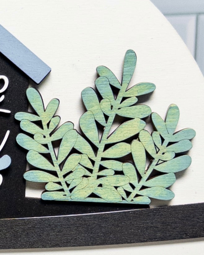 Decorative leaf cutout on a black and white background