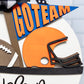 Decorative sign with football helmet, football, and 'GO TEAM' banner on a white background