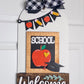 Decorative door hanger with 'School Welcome' text, apple graphic, and checkered bow on a white background.