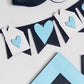 Black and white heart-shaped bunting with blue hearts on a light gray background