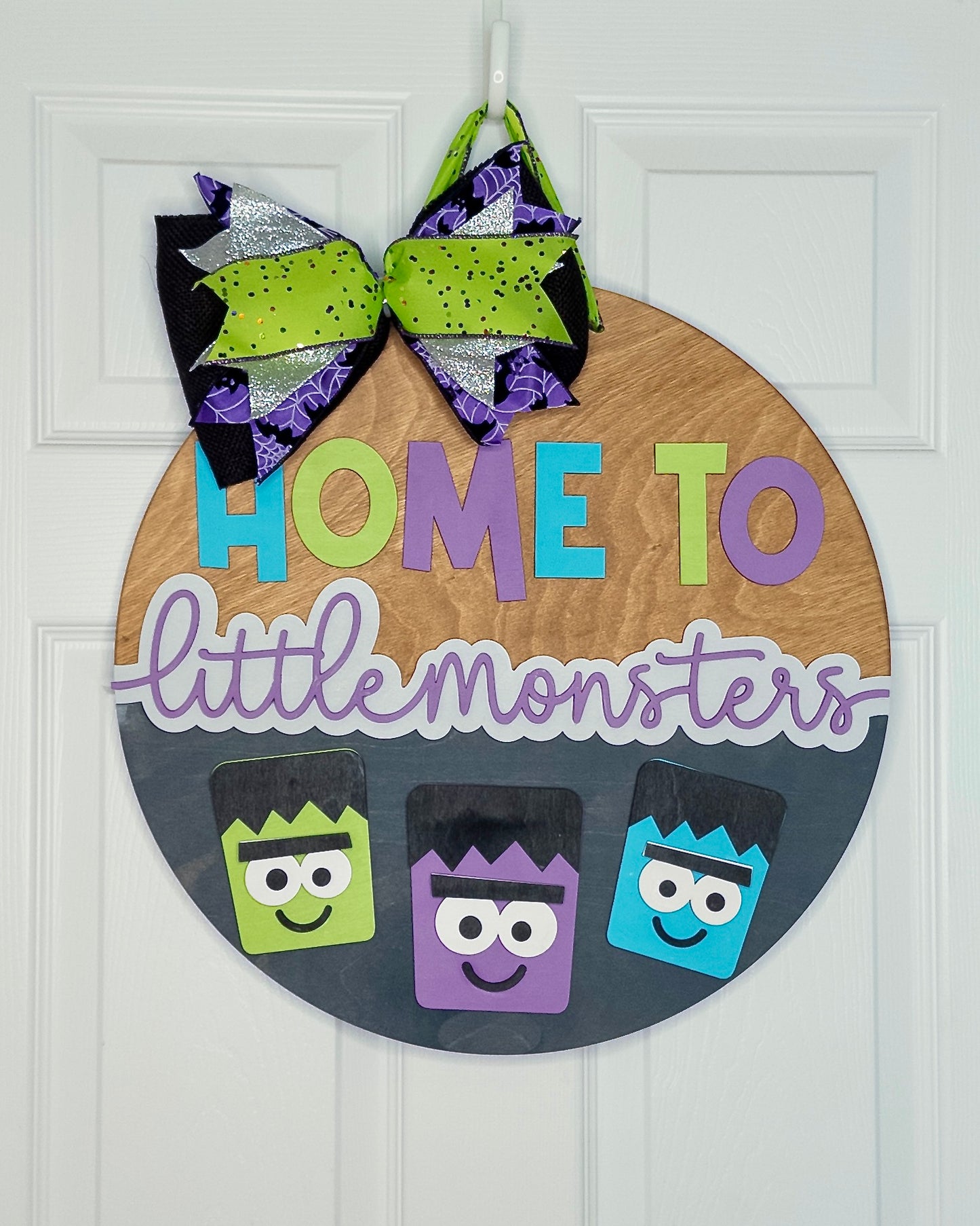 Home to Little Monsters Door Hanger