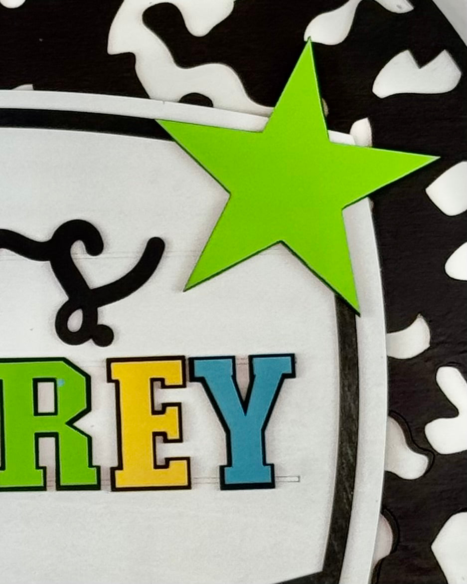 Colorful name 'BILBREY' with a green star on a black and white patterned background