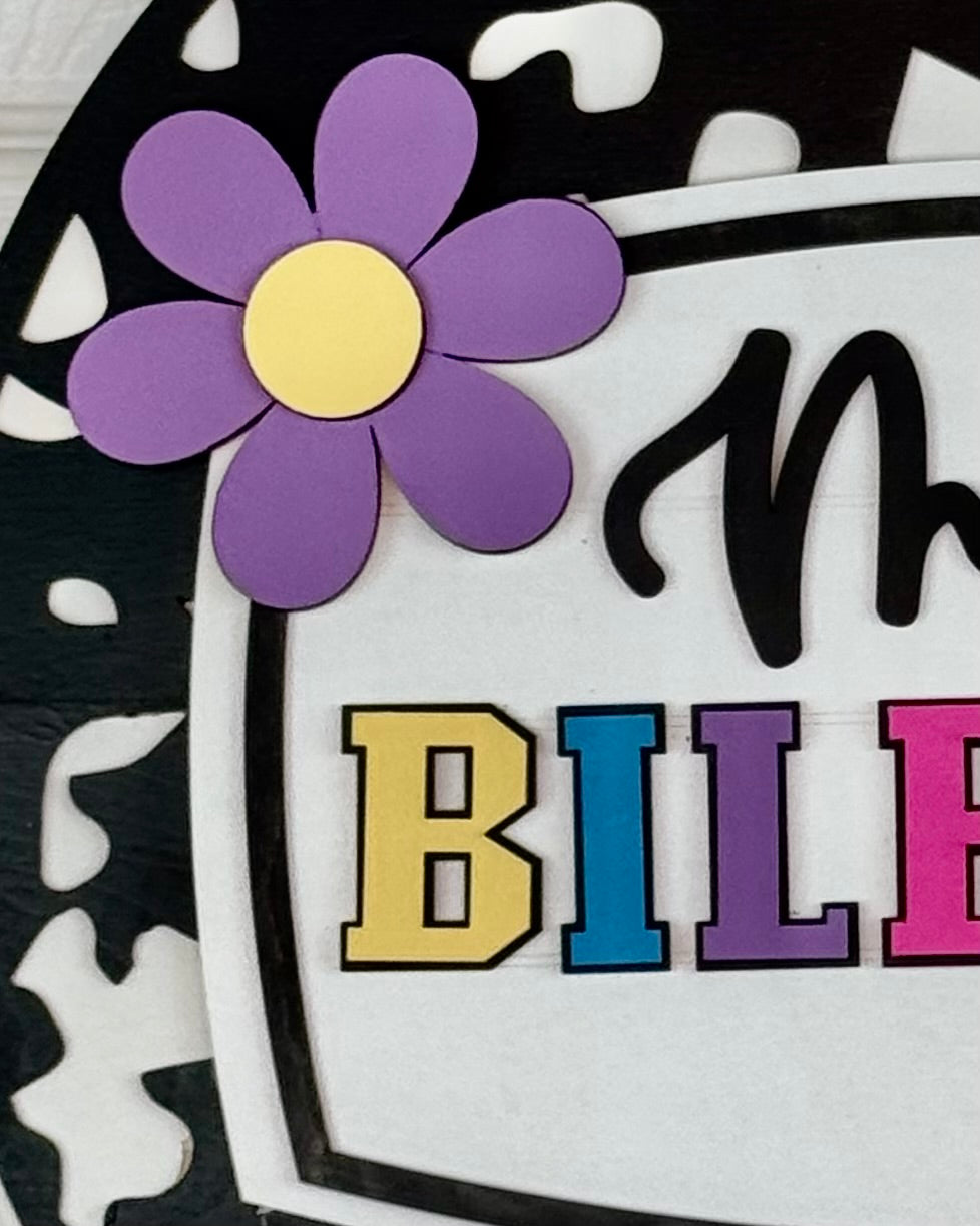 Colorful flower and letters on a black and white background