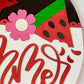 Decorative sign with watermelon slices and a flower, featuring the word 'summer'.