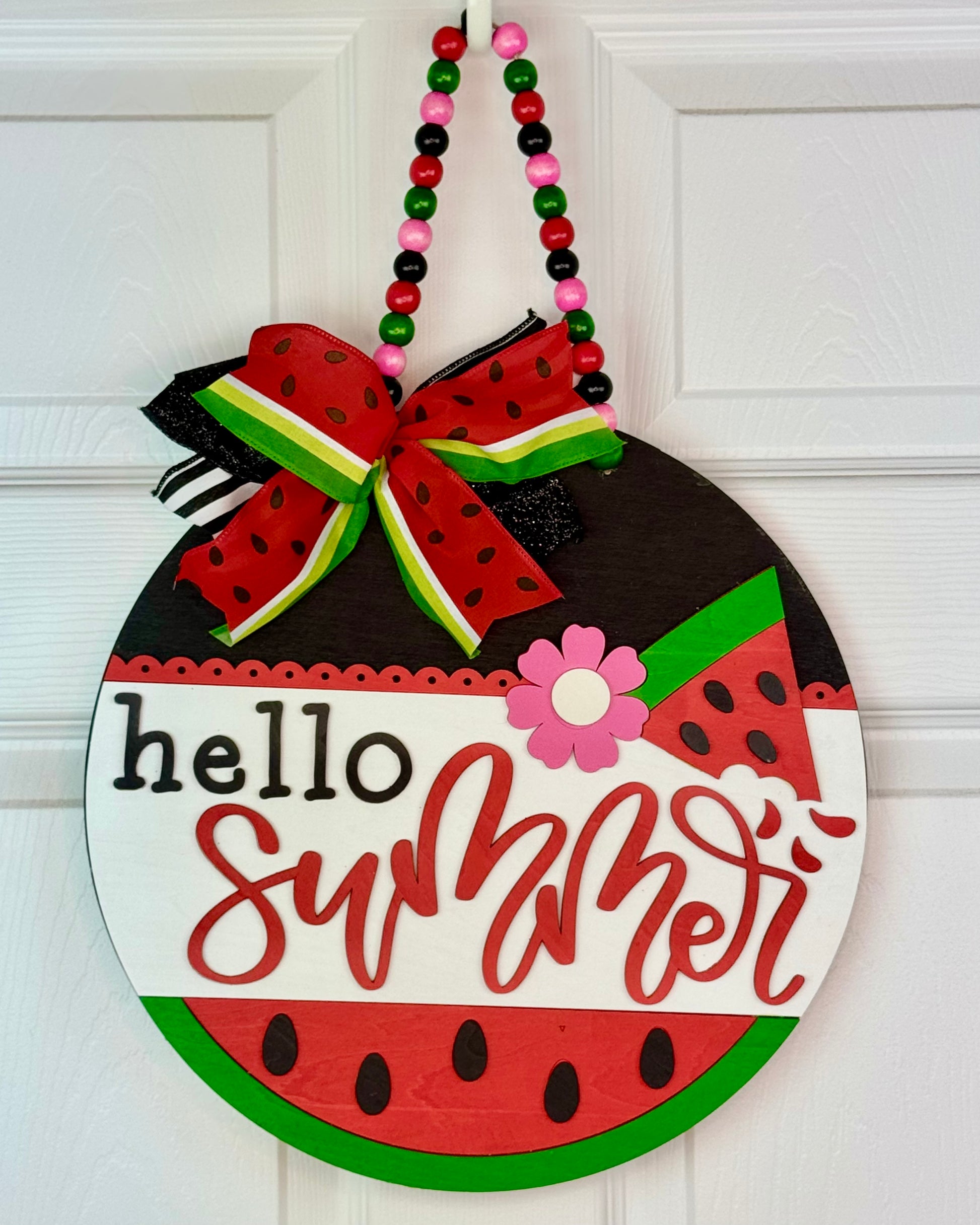 Decorative door hanger with watermelon design and 'hello summer' text on a white background.