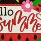 Decorative sign with 'Hello Summer' text surrounded by watermelon slices and a flower.