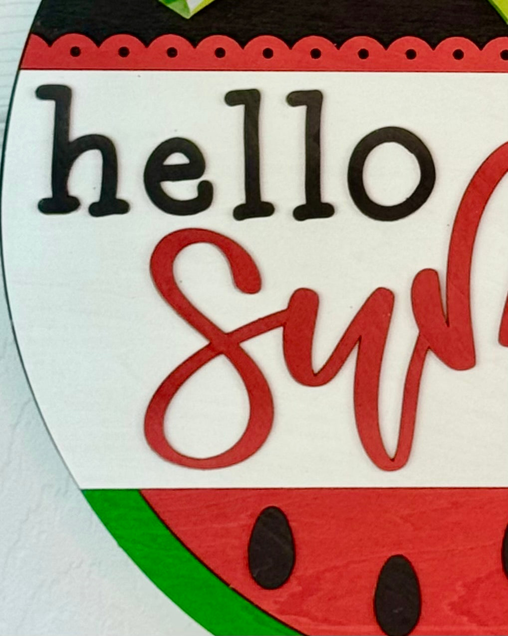 Decorative sign with watermelon design and 'hello summer' text